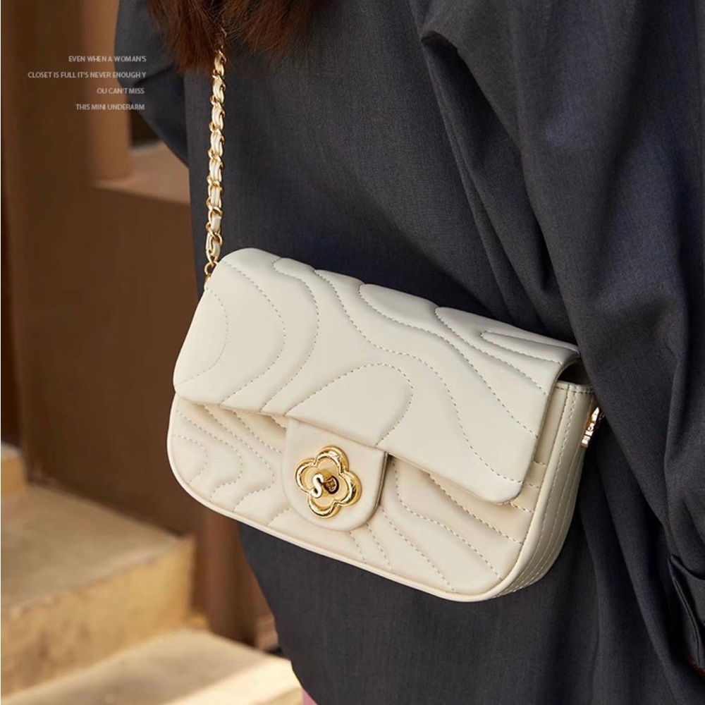 Trendy white mini bag with gold hardware